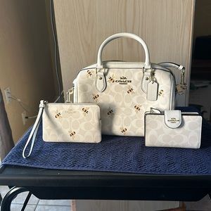 Coach crossbody purse with matching wallet and wristlet